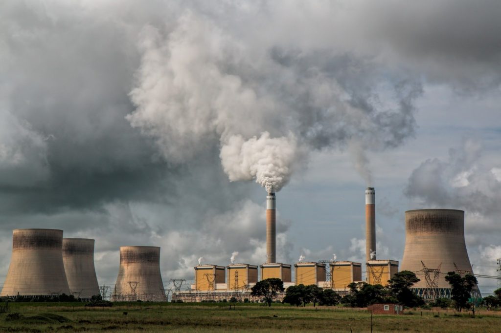 Power station emitting pollutants and smoke into the air