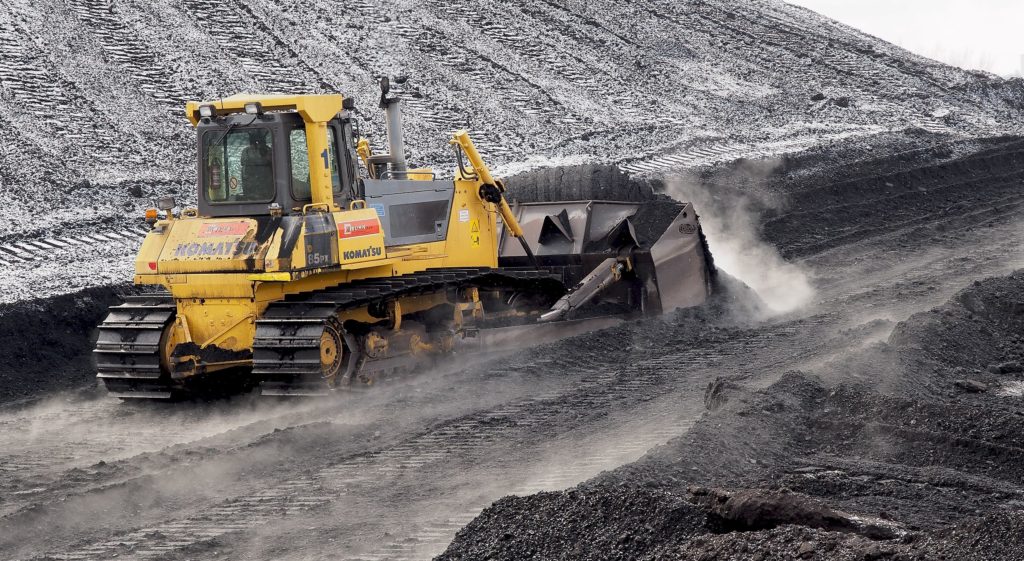 Bulldozer pushing Indonesian coal at coal mine