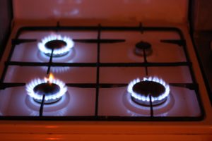 Gas cooker with flames burning