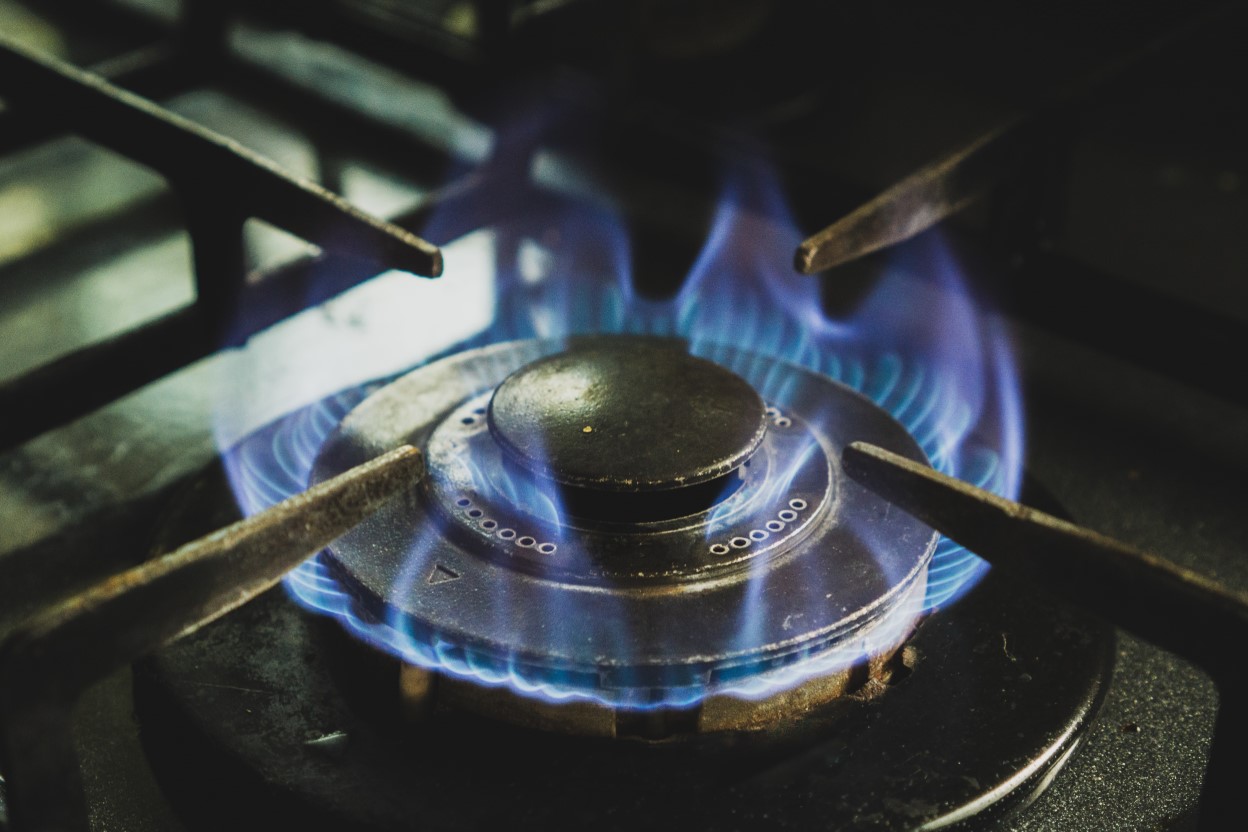 Gas burning on the hob of a cooker