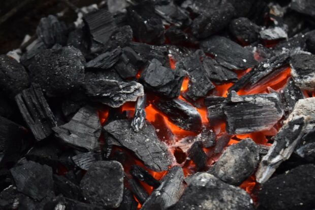 Photograph of coal glowing red as it burns